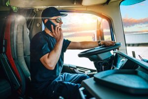 A truck driver talks to a dispatcher.