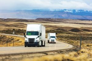 Tractor-trailers on an open highway.