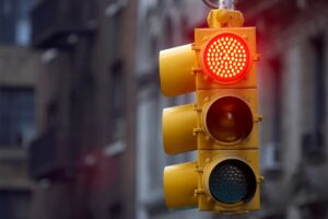 Traffic light on red indicating drivers to stop 